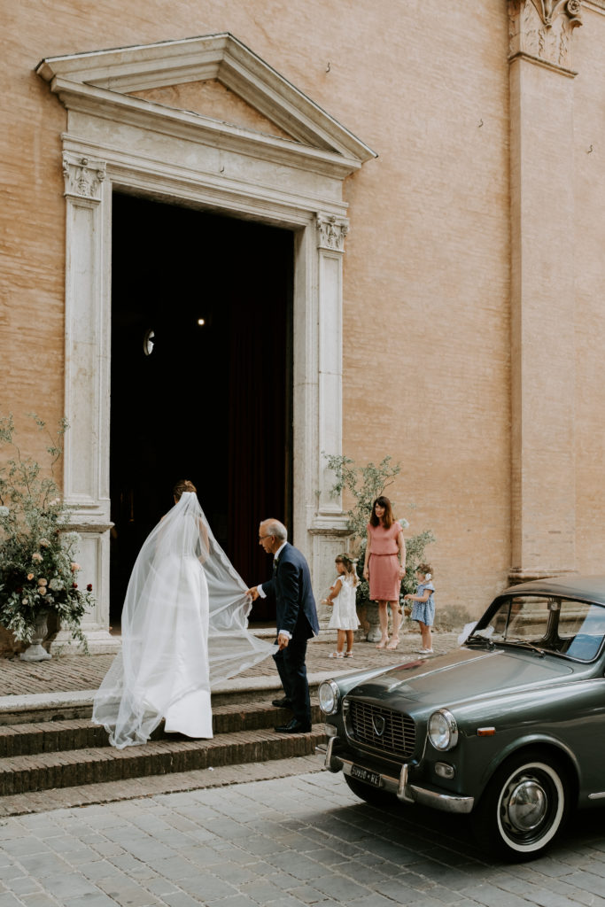 Bride in front of the church - 3 Michelin star wedding in Italy - Italian Wedding Designer